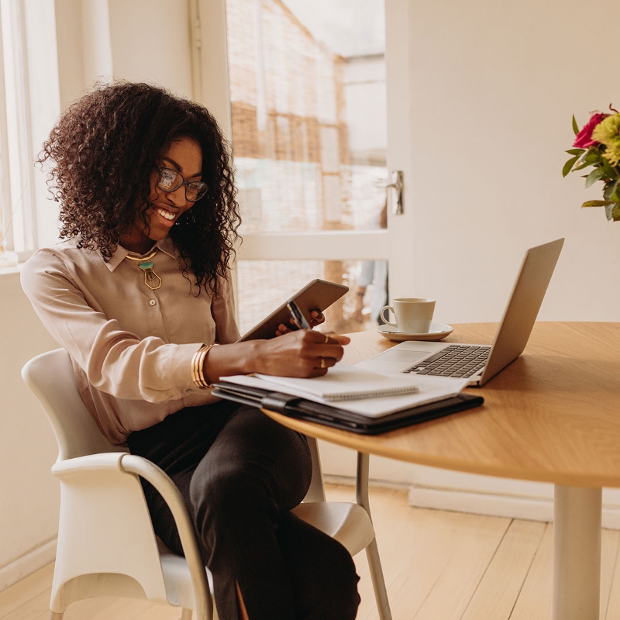 Woman entrepreneur working from home on laptop