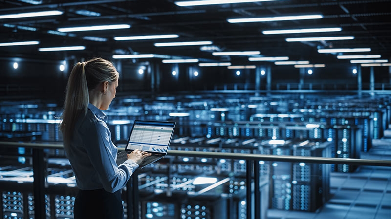 Female IT professional at a data center