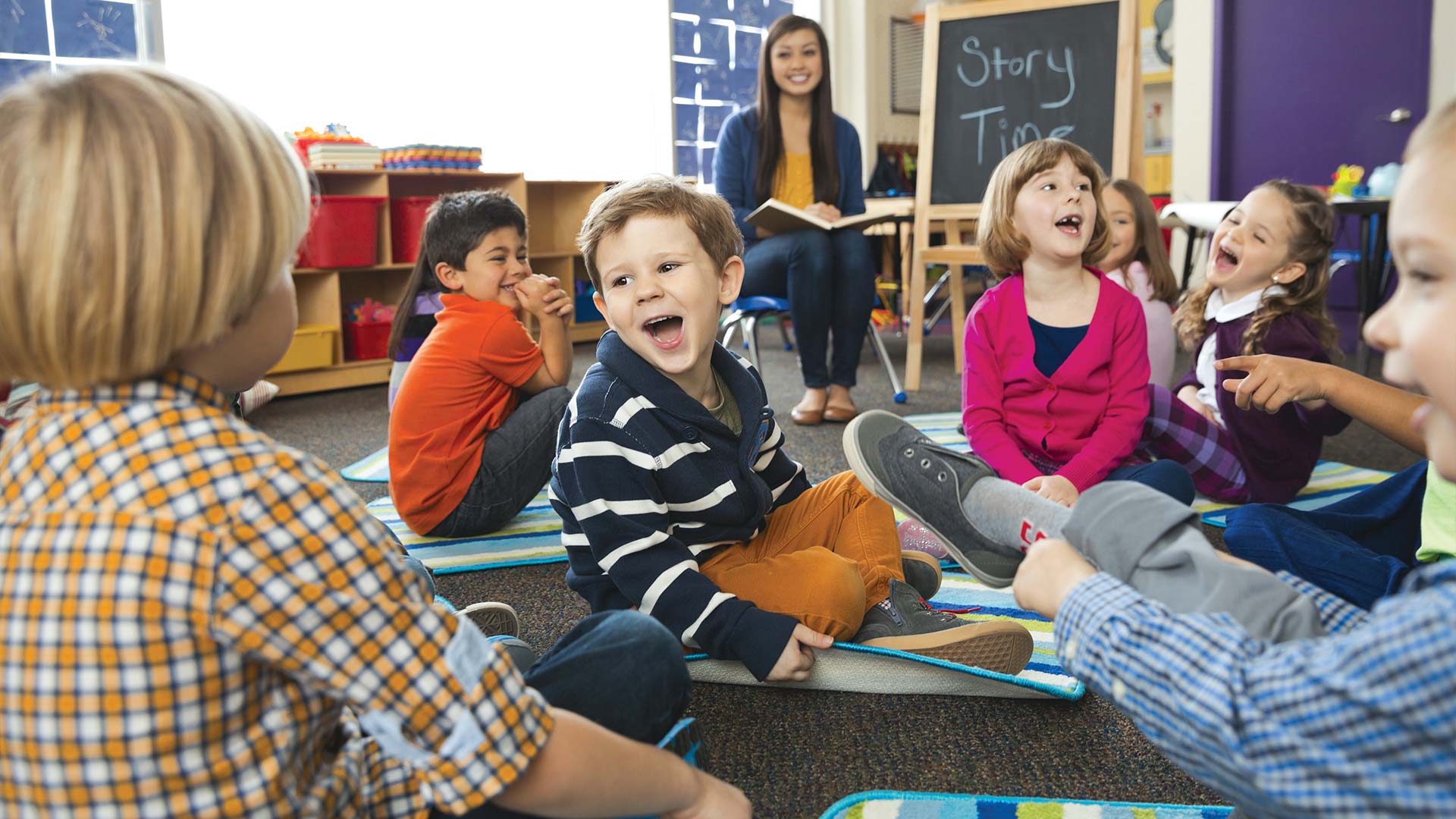 Children laughing on floor