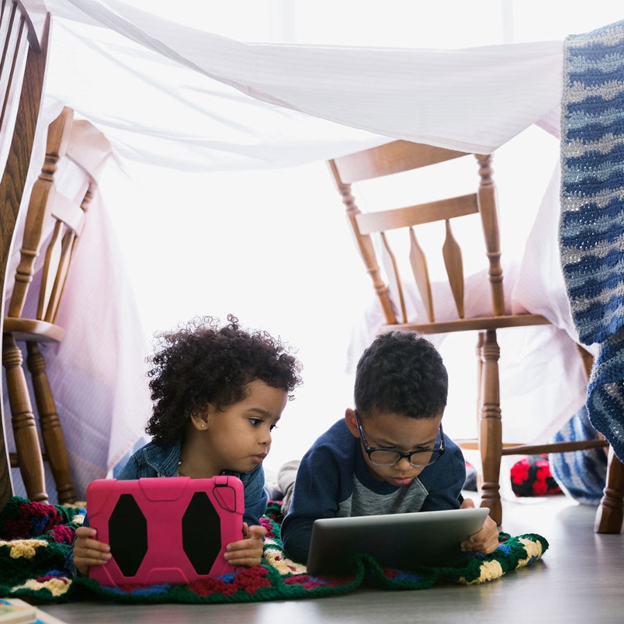 In the house, kids are using tablets