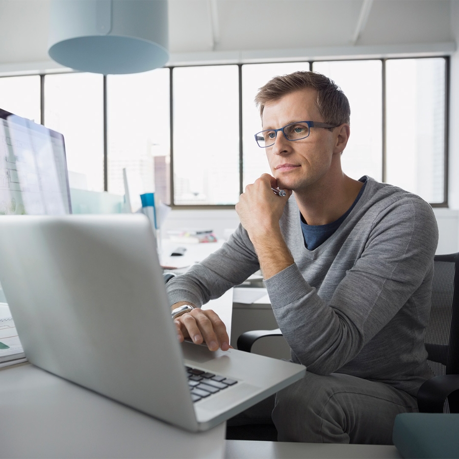 man working on his computer