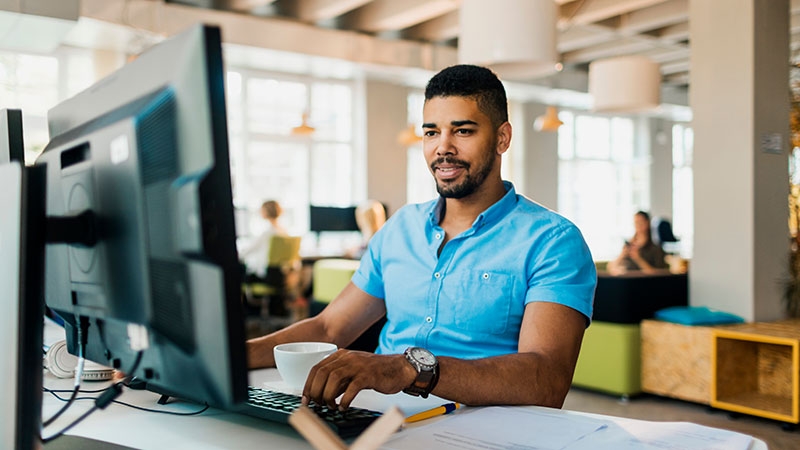 a young man working on laptop