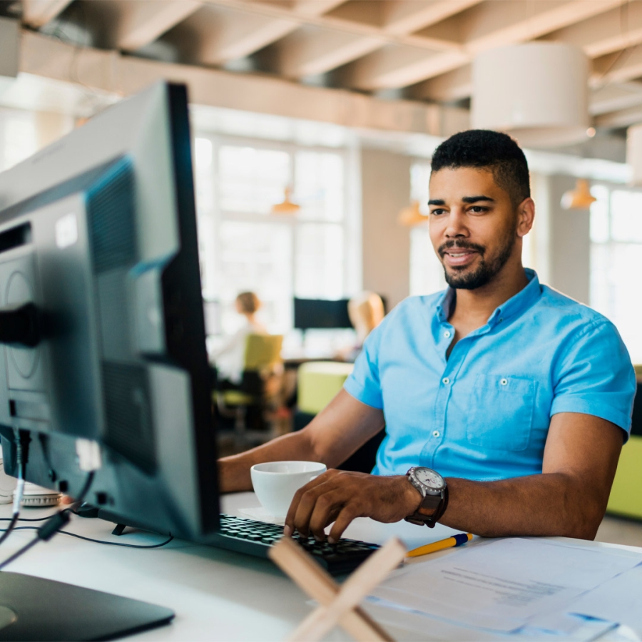 Man working at office desk on computer