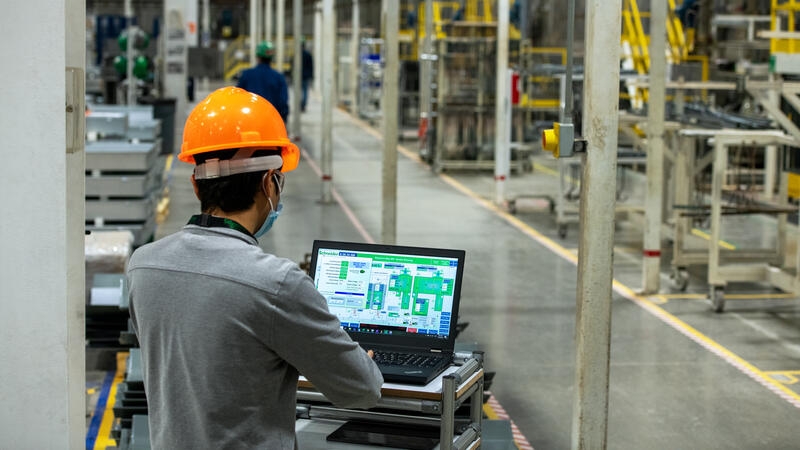 Production worker on a laptop