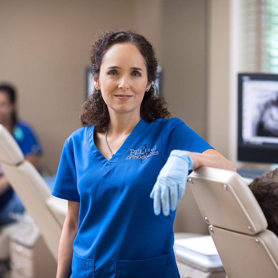 a smiling young medical assistant in clinic