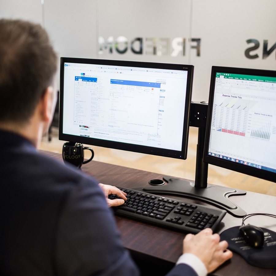 A man working on his desktop computer in office